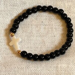 Elegant Black Beaded Bracelet with White Cross